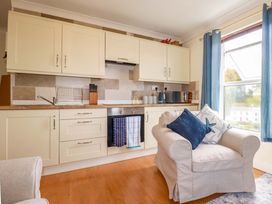 A kitchen with cabinets and a sink at Flat 5 in Looe