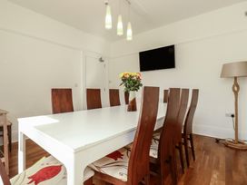 A dining room with a table and chairs at Sea View in Newquay