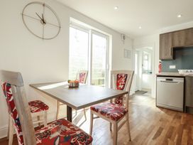A dining room with a table and chairs at Sea View in Newquay