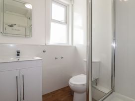 A bathroom with a sink, toilet, and shower at Sea View in Newquay