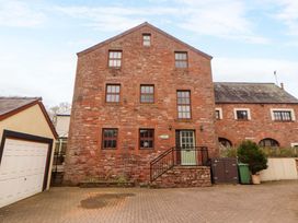 A building with windows and a door at High Mill House in Penrith
