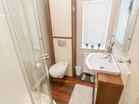 A bathroom with shower, toilet, and sink at 37 Horizon Park in Hartlepool