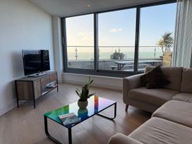 A living room with a television and coffee table at Apartment 29 in Newquay