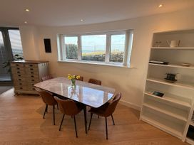 A dining room with a table and chairs at Apartment 29 in Newquay