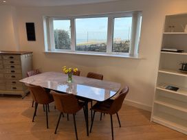A dining room with a table and chairs at Apartment 29 in Newquay