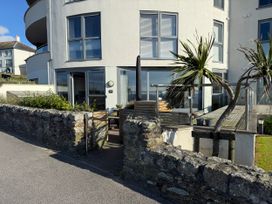 An outdoor area with a plant and furniture at Apartment 29 in Newquay