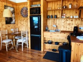 A kitchen with a table and chairs at No 4 in Enniskillen