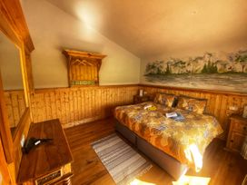 A bedroom with a bed and decorative wall features at No 4 Enniskillen
