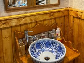 A sink with a blue decorative bowl and faucet in No 4 Enniskillen