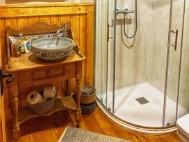 A bathroom with a shower and sink at No 4 Enniskillen