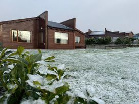 A house with windows and a grassy area at No 4 in Enniskillen
