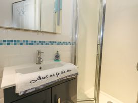 A bathroom with a sink and shower at Chandlers Nook in Portland