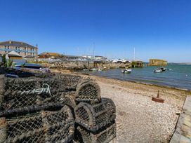 A waterfront scene with boats and fishing traps at Chandlers Nook in Portland