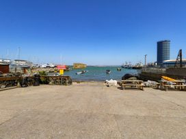 A view of a harbor with boats and a pier at Chandlers Nook in Portland