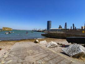 A view of the water with boats and a pier at Chandlers Nook in Portland