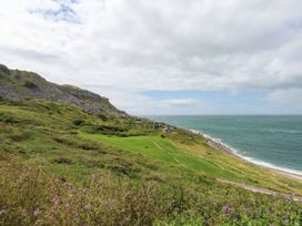 A coastal landscape with cliffs and ocean at Chandlers Nook in Portland