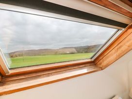 A window with a view of hills and fields at The Annexe at Cherry Cottage Upton St Leonards