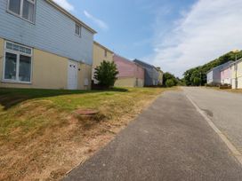 A street view of houses with grass and trees at 62 Golf Lodges Atlantic Reach near Fraddon
