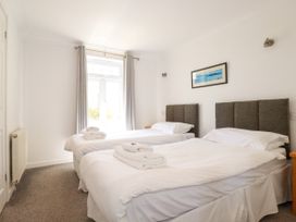 A bedroom with two beds and a window at 62 Golf Lodges Atlantic Reach near Fraddon