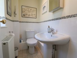 A bathroom with toilet and sink at Phoenix Cottage in Lyme Regis