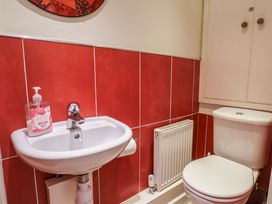 A bathroom with a sink and toilet at Phoenix Cottage Lyme Regis