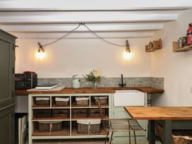 A kitchen with a sink and countertop at Bedford Cottage in Yelverton