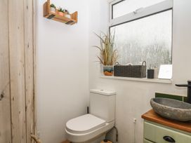 A bathroom with a toilet and sink at Bedford Cottage in Yelverton