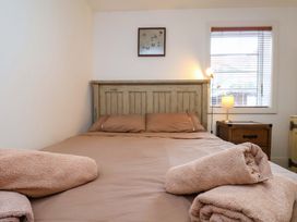 A bedroom with a bed and lamp at Apartment 12 