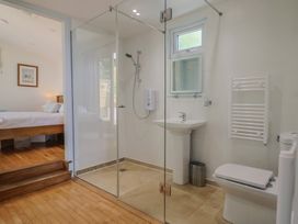A bathroom with shower and sink at Salt & Stone Lyme Regis