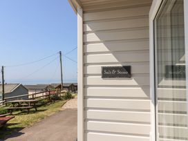 A view of the exterior signage for Salt & Stone in Lyme Regis