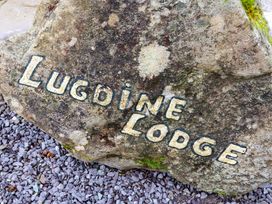 A rock with the name Lugdine Lodge at Lugdine Lodge Glengarriff