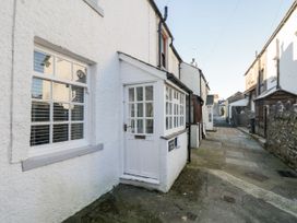 An exterior view of a cottage with a pathway at Burnside Cottage in Grange-Over-Sands