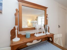 A table with a mirror and ornament in Burnside Cottage, Grange-Over-Sands