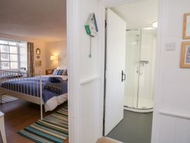 A bedroom with a view of a shower at Burnside Cottage in Grange-Over-Sands