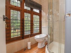 A bathroom with a shower and toilet at West Down Country House South Molton