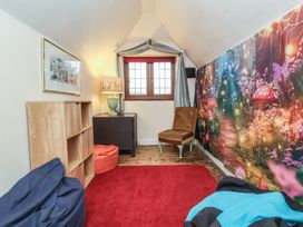 A seating area with bean bags and a shelf at West Down Country House in South Molton