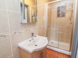 A bathroom with a sink and shower at West Down Country House in South Molton
