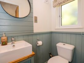 A bathroom with sink and toilet at Daisy Shepherd's Hut South Molton