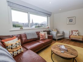 A living room with a sofa and coffee table at Ambwray in Ambleside
