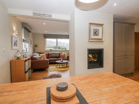A living room with a sofa and fireplace at Ambwray in Ambleside