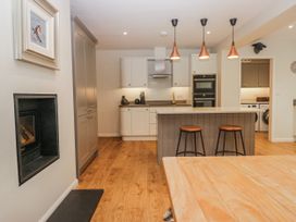 A kitchen with cabinets and appliances at Ambwray in Ambleside