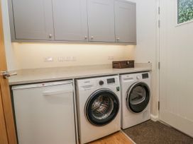 A laundry room with a washing machine and dryer at Ambwray in Ambleside