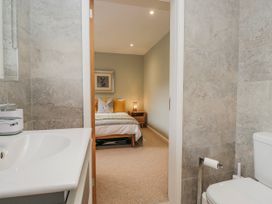 A bathroom with a view into the bedroom at Ambwray in Ambleside