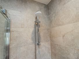 A shower with tile walls at Ambwray in Ambleside