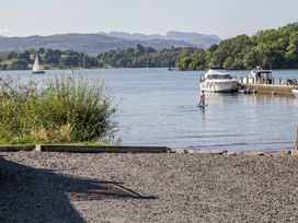 A view of boats on water with mountains in the background at Ambwray in Ambleside