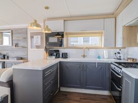 A kitchen with appliances and counter space at Bordeaux in Ladram Bay Otterton