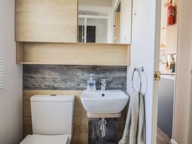 A bathroom with a toilet and sink at Bordeaux, Ladram Bay Otterton