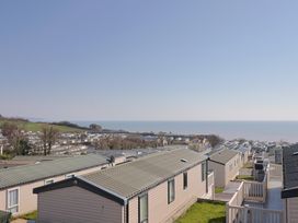 A view of caravans with the sea in the background at Bordeaux in Ladram Bay Otterton