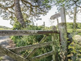 An outdoor gate leading to a green area at Cottage 1 Braithwaite