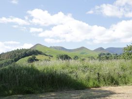A view of mountains and grass in the outdoors at Cottage 1 in Braithwaite